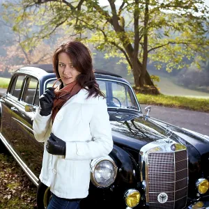Young Woman in Front of Post-War Classic Car Print