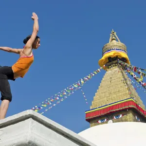 Young woman practicing yoga at Boudnanath stupa