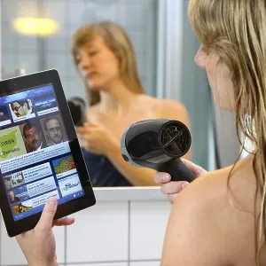 Young Woman Reading News on iPad in Morning Print