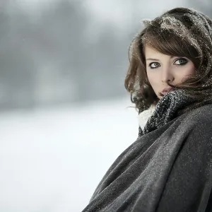 Young woman in snow, portrait