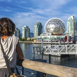 Young woman tourist is enjoying the cityscape of vancouver Young woman tourist is enjoying the cityscape of vancouver