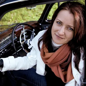 Young woman in a vintage MB vehicle Young woman in a vintage MB vehicle