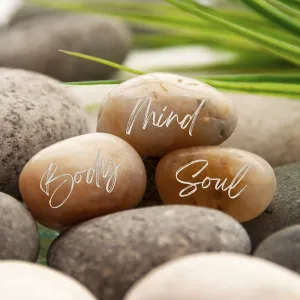 Zen stones with words Mind, Body and Soul with space for text