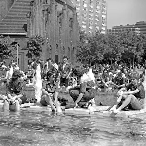 02.06.1979, East Berlin, National Youth Meeting 1979, fountain at Alexanderplatz, young people with FDJ shirts cooling off at the edge of the fountain. East Berlin, Berlin-Mitte, GDR GDR