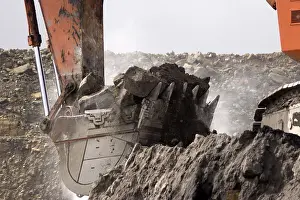 190 ton digger picks up a load of rock overburden at an open cast coal mine