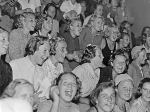 In the 1930s. An audience of young women who is visible exited