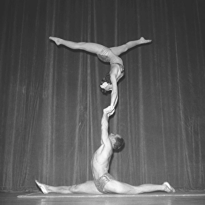 1940s acrobatic show. The three acrobats practice their balance act behind the stage prior the performance on stage