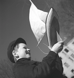In the 1940s. A boy with his model sailboat pictured when he tries it on this spring day in Stockholm at the pond next