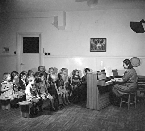 1940s children. A group of children are singing christmas songs at a nursery school in Stockholm. Sweden 1947. Conard ref 884