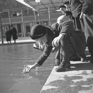 In the 1940s. A girl with a small model sailboat pictured on this spring day in Stockholm at the pond next to Observatorielunden in central Stockholm. Sweden 23 april 1940 Kristoffersson ref 116-16