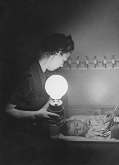 In the 1940s. An mother is in a room where her child is lying in a bed and sleeping