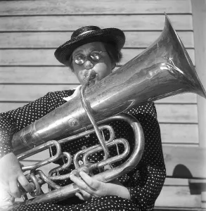 1940s musical woman. Wilma Lanz in an all-women band is playing the bass tuba
