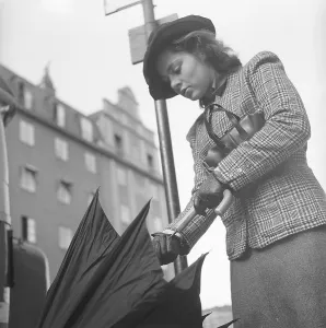 1940s woman in raincoat. Actress Viveca Lindfors