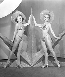 In the 1940s. Two young women from the theater ensemble from Soedra teatern in Stockholm are dressed in their stage