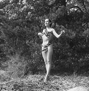 In the 1950s. Beutiful Iris Johansson on a summer day wearing men's neckties as a bikini-like outfit