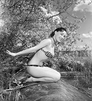 In the 1950s. Beutiful Iris Johansson on a summer day wearing men's neckties as a bikini-like outfit