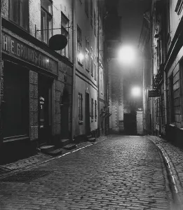 In the 1950s. An evening view of a street with old houses