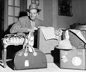 In the 1950s. A man with different kinds of luggage in front of him