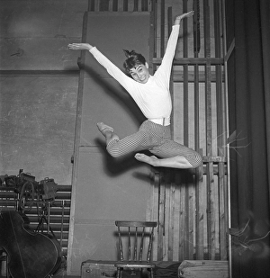 In the 1950s. An unknown young woman is pictured in the moment when being highest in the air having jumped off