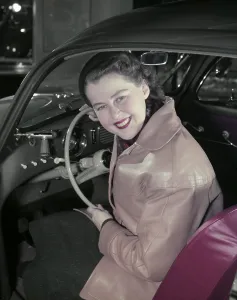 In the 1950s. A woman pictured in the driving seat of a car. Sweden 1958 Conard ref BV43-5