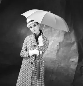 1950s woman with umbrella. A young woman is holding an umbrella