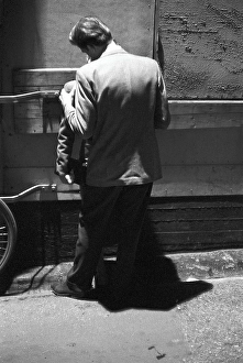 In the 1950s. A young couple in the evening standing close to each other