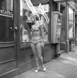 In the 1950s. A young woman dressed in underwear