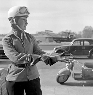 In the 1950s. A young woman seen on a german made Puch scooter