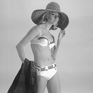 1960s bikini fashion. A fashion model in a bikini in 1963