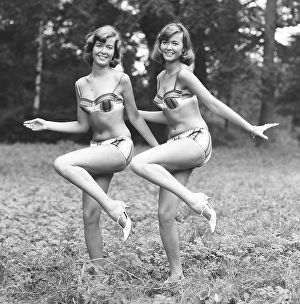 1960s bikini fashion. Twins wearing bikini