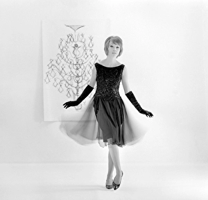In the 1960s. A fashion model in a typical 1960s dress