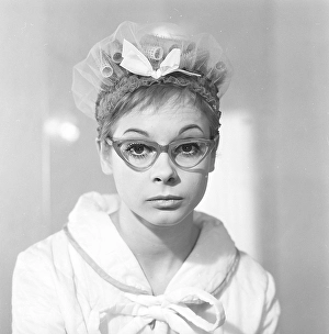1960s glasses. A young woman in glasses and bows January 1961