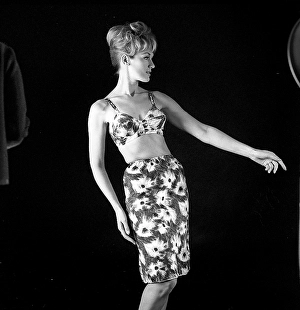 In the 1960s. A model in a typical 1960s outfit photographed in a studio