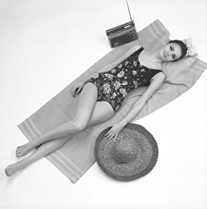 1960s swimsuit fashion. A fashion model wearing the swimsuit fashion of 1963