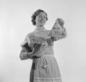 In the 1960s. A woman with groceries