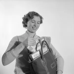 In the 1960s. A woman with her shopping bag