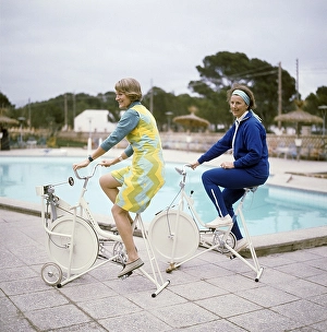 In the 1960s. Two women on a charter trip to Spain are using their vacation to exercise