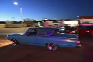 A 1964 Mercury Monterey turns onto Route 66 in the evening light