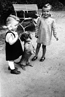 2 girls with dog (Dackel), ca. 1955