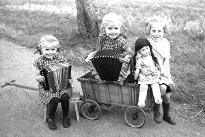 2 girls playing accordion, 1945, ca