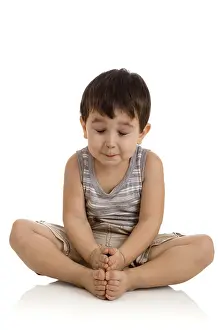 3 years old boy relaxing on white background