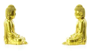 3d illustration of two golden buddha figures with copy space between them