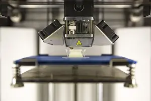 A 3D printer prints a white plastic detail