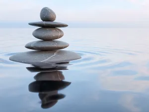 3d rendering of Zen stones in water with reflection