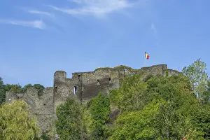 9th century medieval ruined hill castle overlooking the city La Roche-en-Ardenne in summer