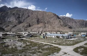 Abandoned buildings in a barren landscape