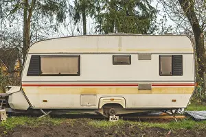 Framed Print : Abandoned vintage caravan / camper Van parked at the garden Framed Print : Abandoned vintage caravan / camper Van parked at the garden