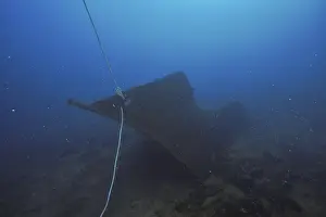 An abandoned wreck with a rope rests on the seabed in the Mediterranean near Hyeres