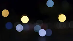Abstract dark background with sparkling yellow and blue lights