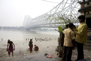 Activities on Babu ghat, Howrah bridge over Hooghly river in background